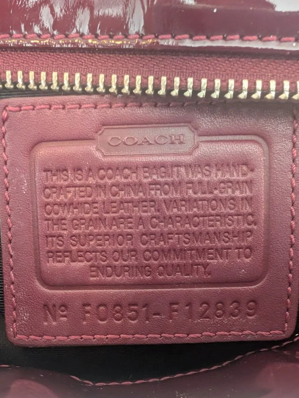 Coach Plum/Burgundy patent leather handbag